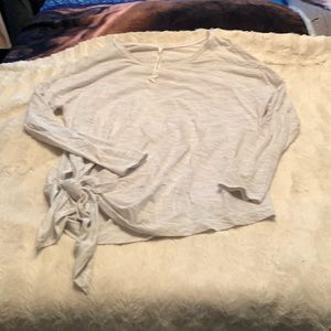 Size 12 Grey lululemon side tie work out top. Worn a lot but great condition.